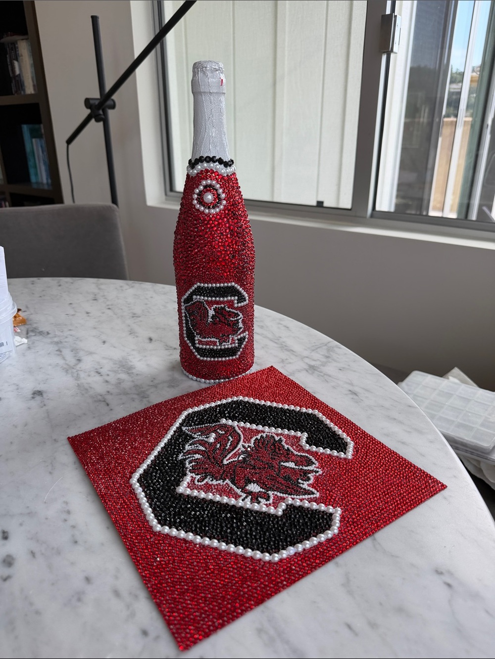 University of South Carolina grad, hat, cover, and sparkling cider bottle